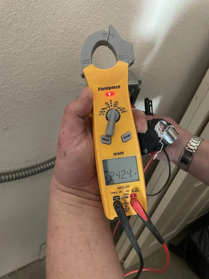 Voltage testing with clamp meter during Aluminum Wiring Replacement in East Moline